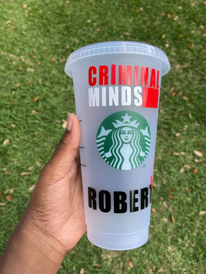 Front of starbucks cup with the Criminal Minds logo in red and white